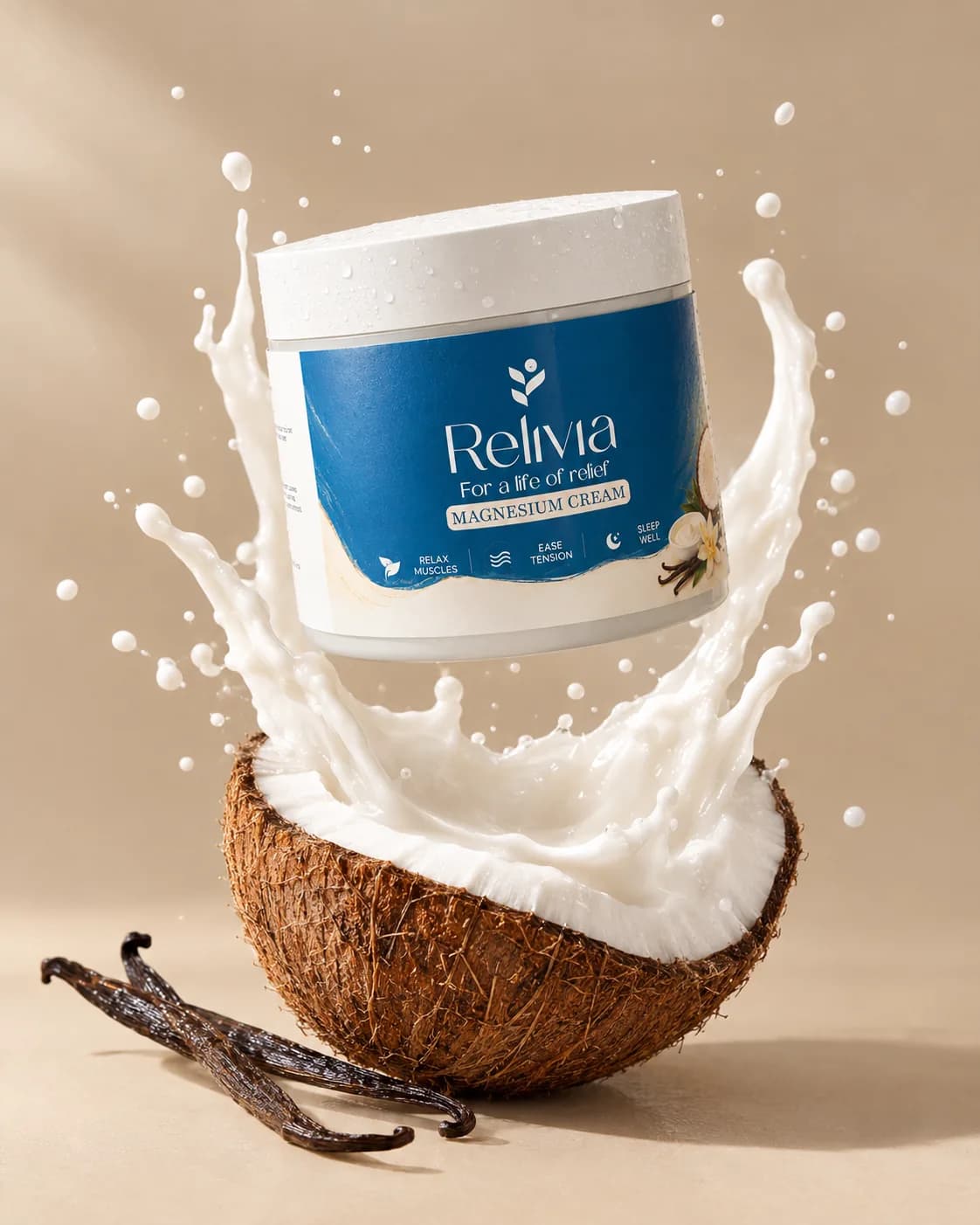 The jar above a halved coconut in a splash of coconut milk, vanilla pods beside it